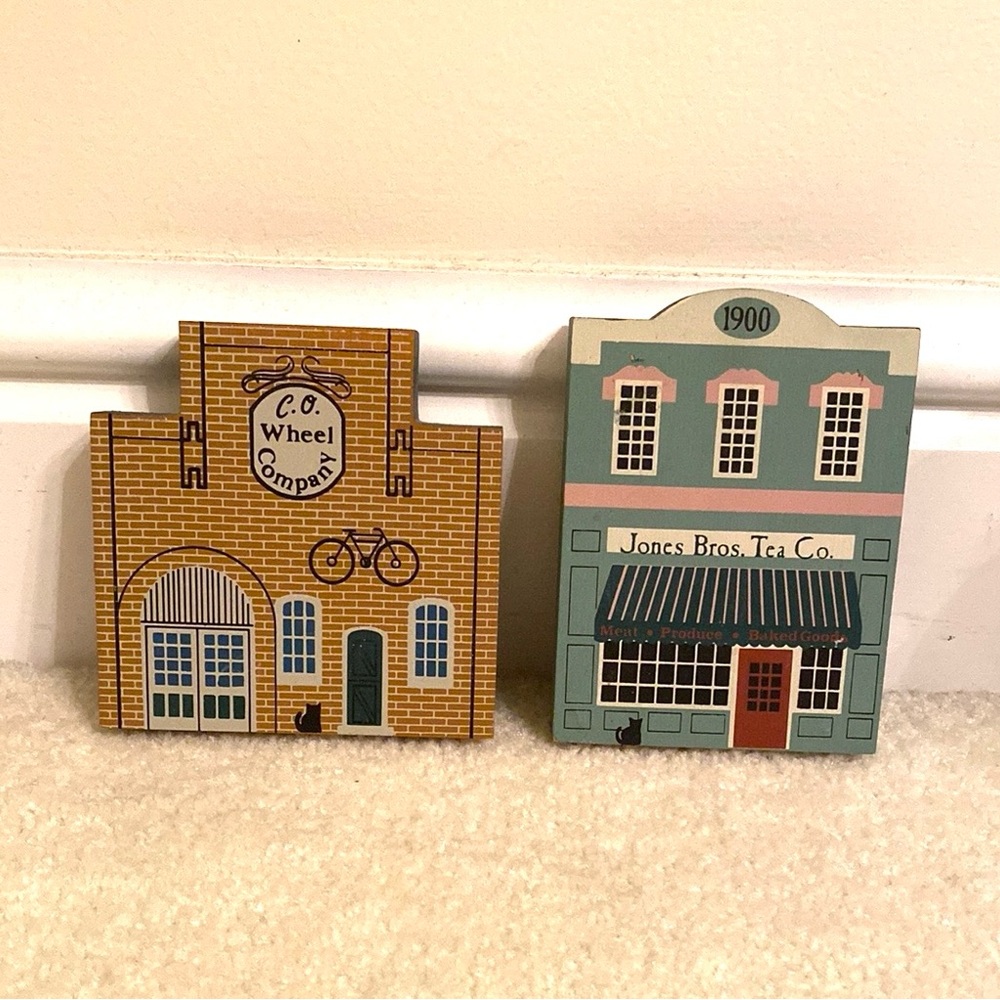 2 Cat's Meow Village pieces. Jones Bros. Tea Co. AND C.O. Wheel Company